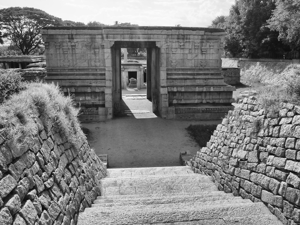 Royal stepped tank (Pushkarini) with ornate stone gateway, Hampi