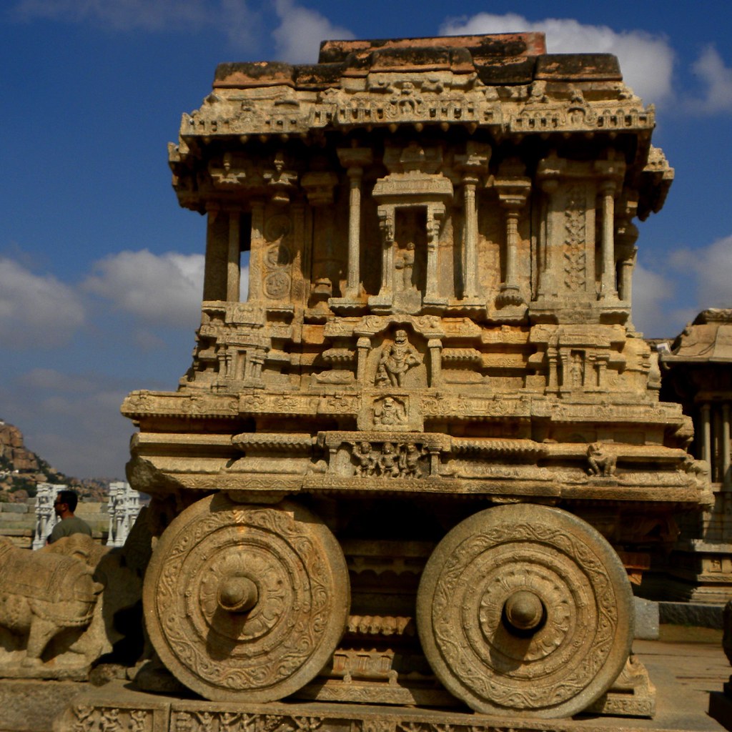 Vittala Temple's iconic stone chariot with carved wheels and sculpted horses, Hampi