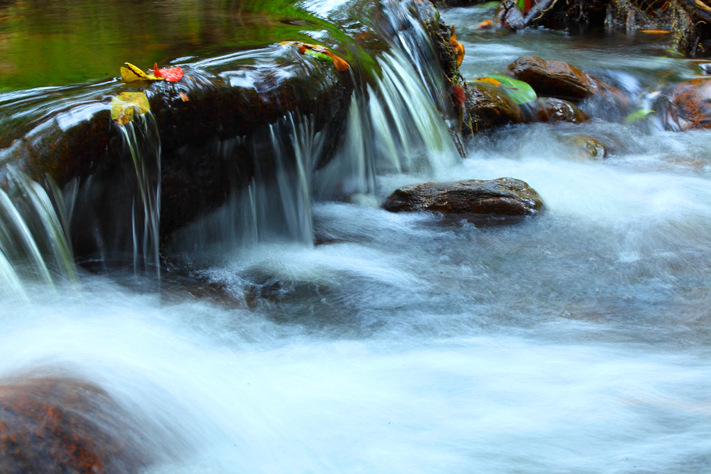 Rocky forest stream cascading through the hills near Munnar