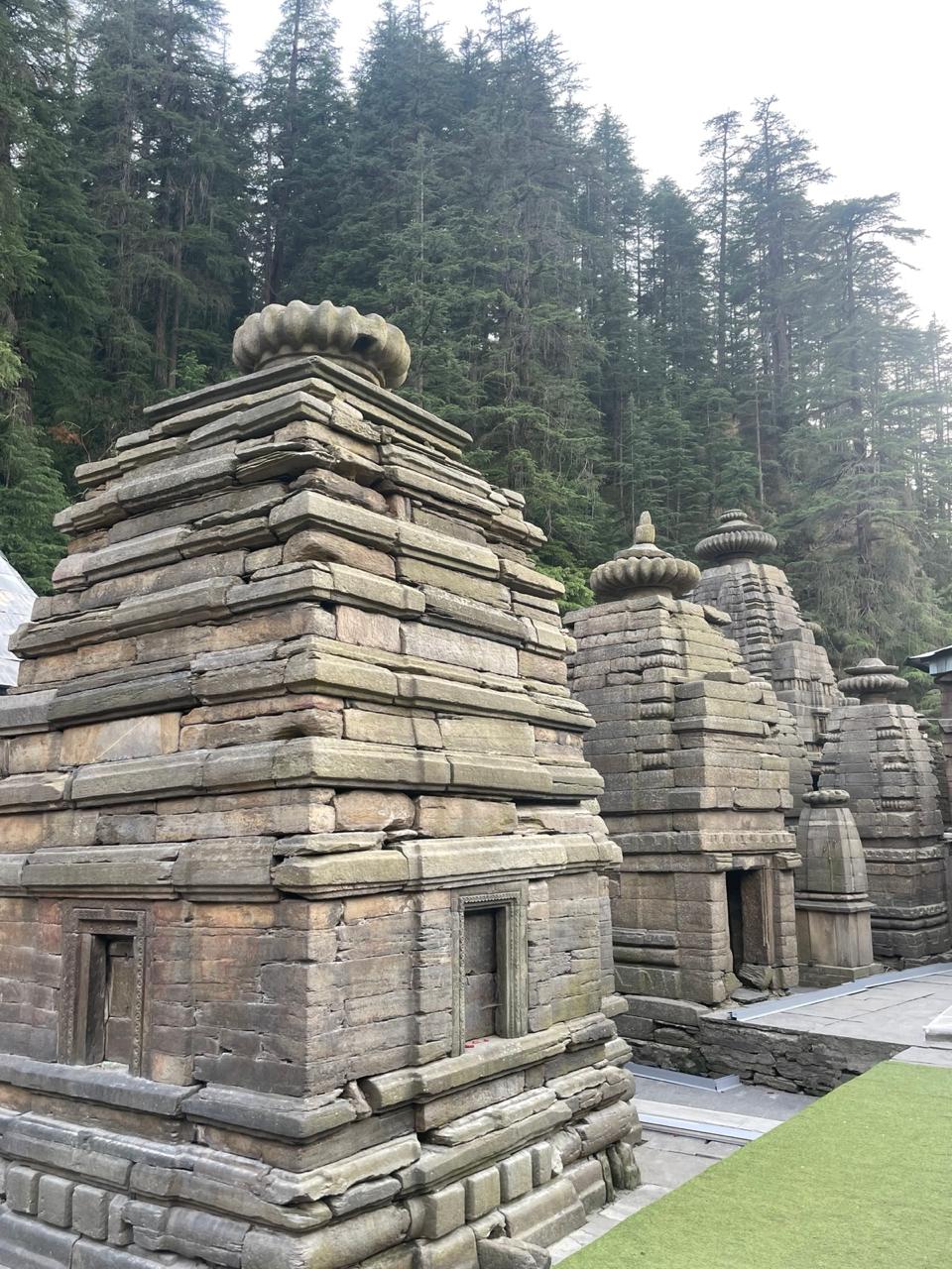 Ancient Nagara-style stone temples at Jageshwar amid deodar forest