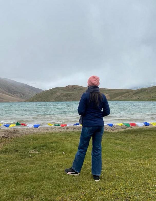 Dhankar Lake with Tibetan prayer flags and turquoise water, Spiti Valley
