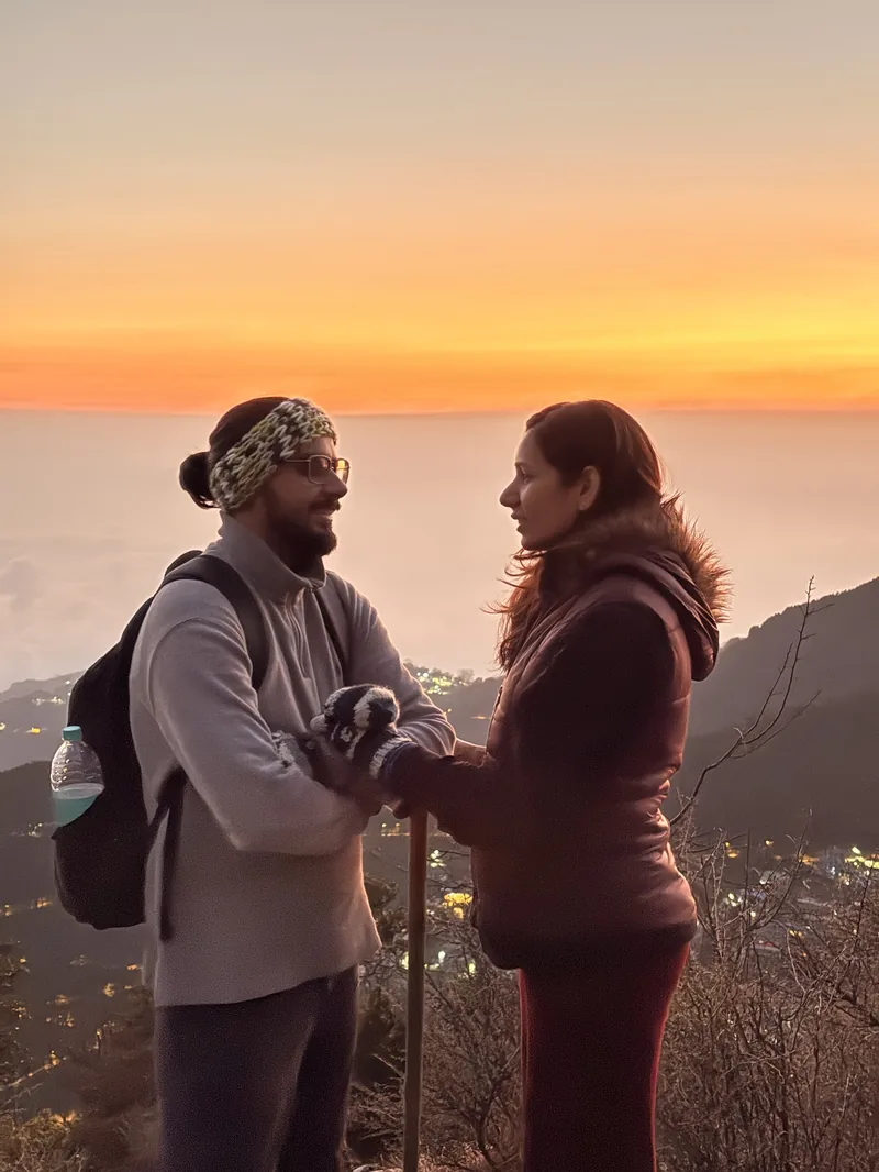 Chetna and Samarth, Co-founders of RoamRani, at sunrise in the Himalayas